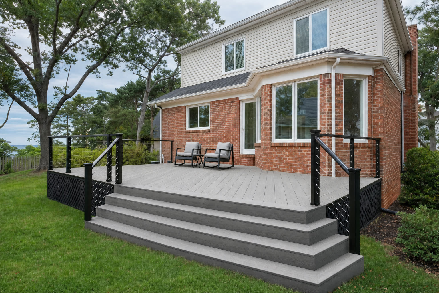 The same composite deck shown with weathered grey coloured boards