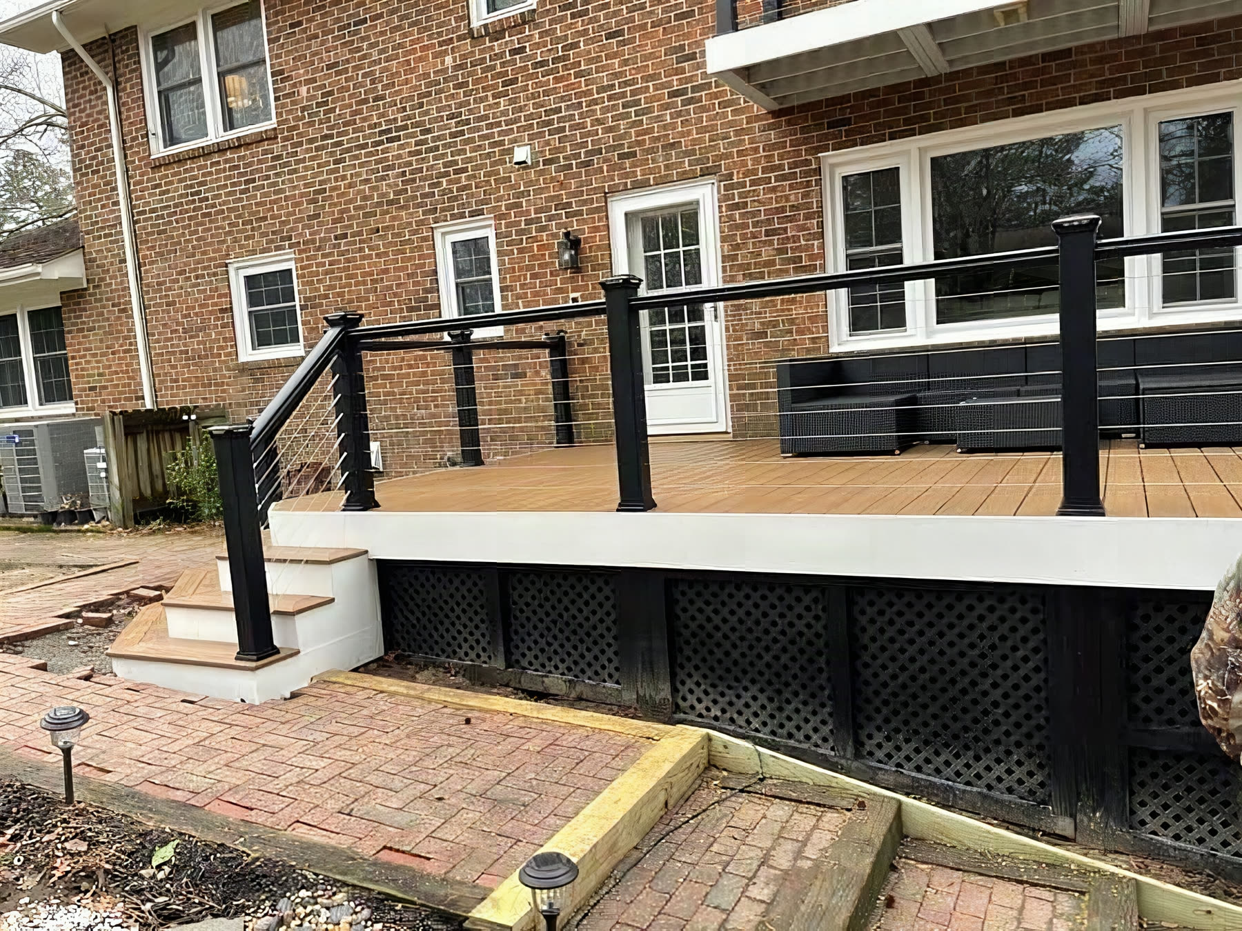 Stainless cable railing on a composite deck