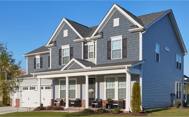 Grey home with cedar look siding